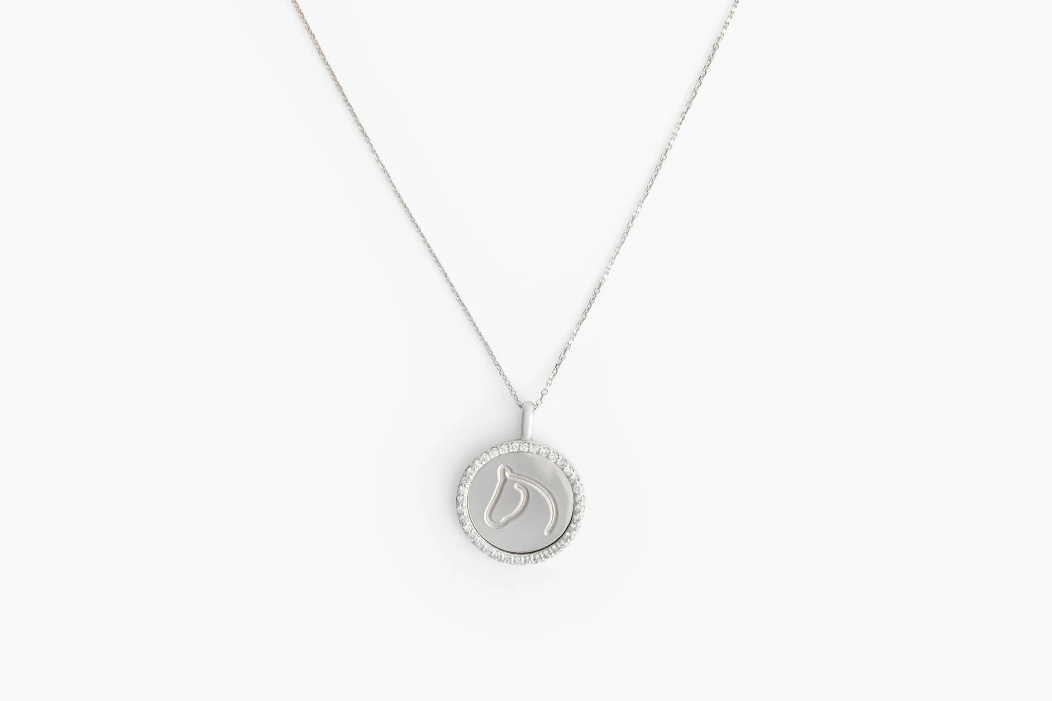 White gold Circle Medallion horse pendant with a diamond border on a fine chain