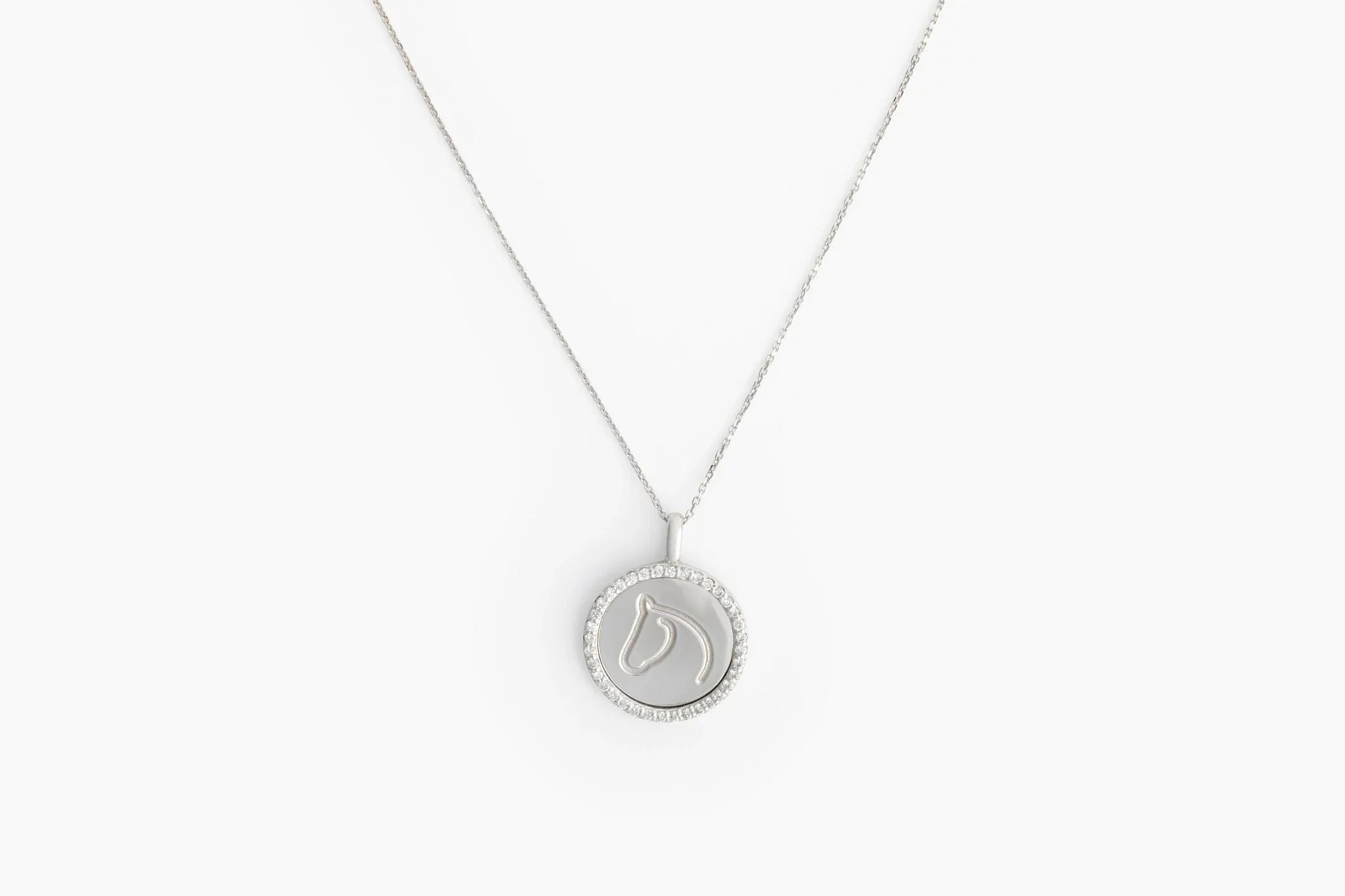 White gold Circle Medallion horse pendant with a diamond border on a fine chain
