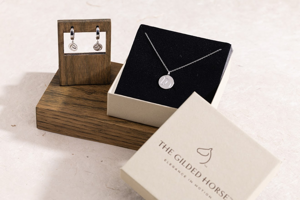 horse jewelry trends 2026, sterling silver Circle Medallion dangle earrings and pendant necklace in The Gilded Horse gift box