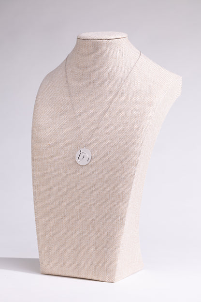 XL Sterling Silver Circle Medallion Pendant Necklace from The Gilded Horse on a beige mannequin. 