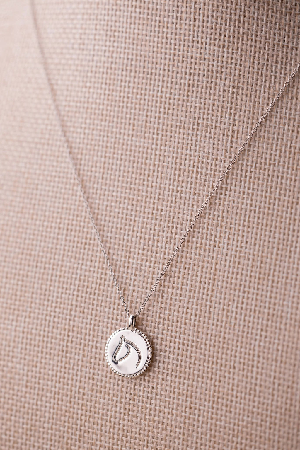 Sterling silver beaded-border circle medallion with engraved equestrian horse head