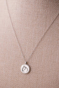 Sterling silver beaded-border circle medallion with engraved equestrian horse head