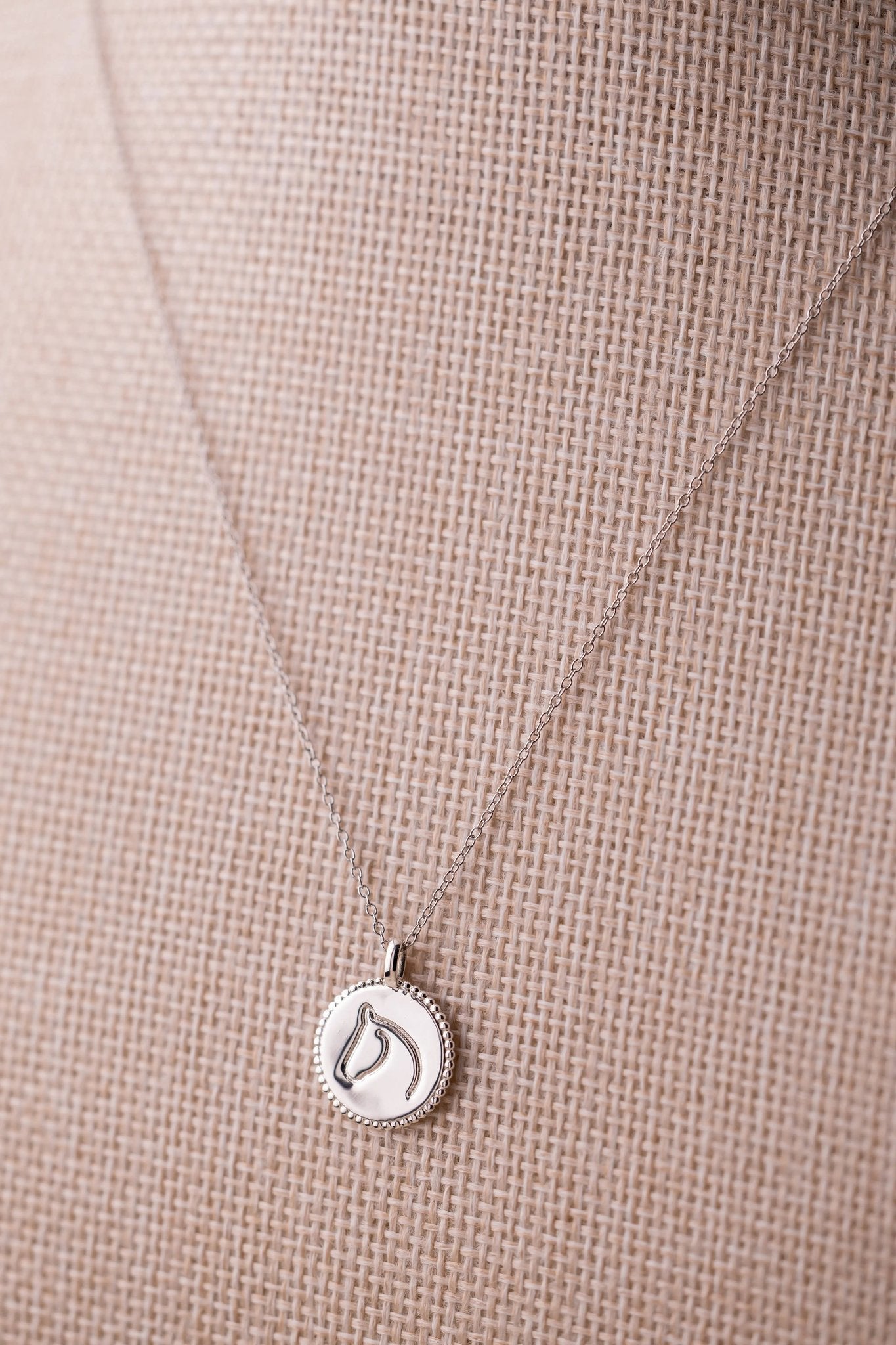 Sterling silver beaded-border circle medallion with engraved equestrian horse head
