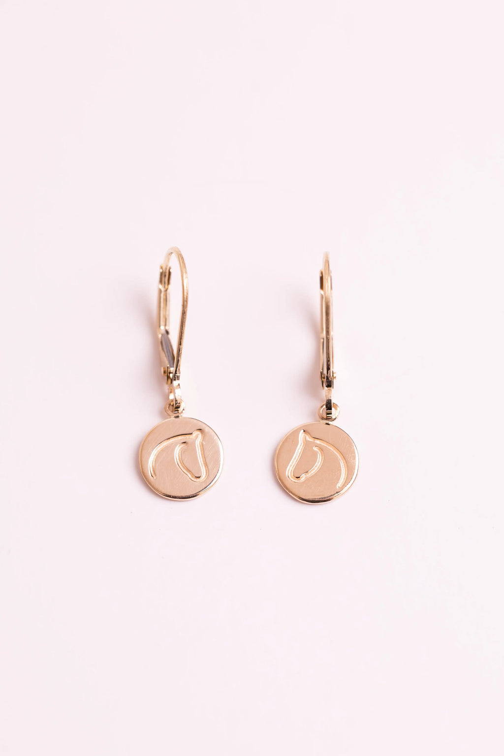 Gold earrings with The Gilded Horse logo with a white background.