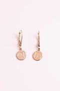 Gold earrings with The Gilded Horse logo with a white background.