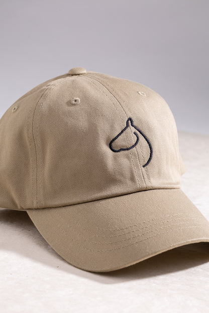Beige cap with a black embroidered logo on a light gray background