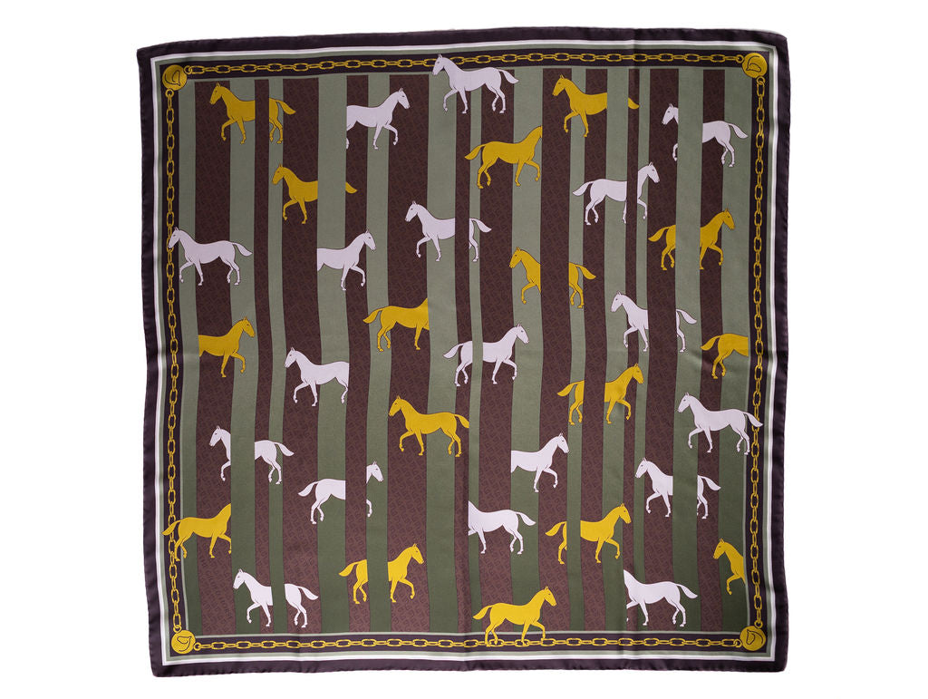 A square scarf featuring a pattern of stylized horse silhouettes in yellow and white against vertical olive green and dark brown stripes, finished with a decorative border.