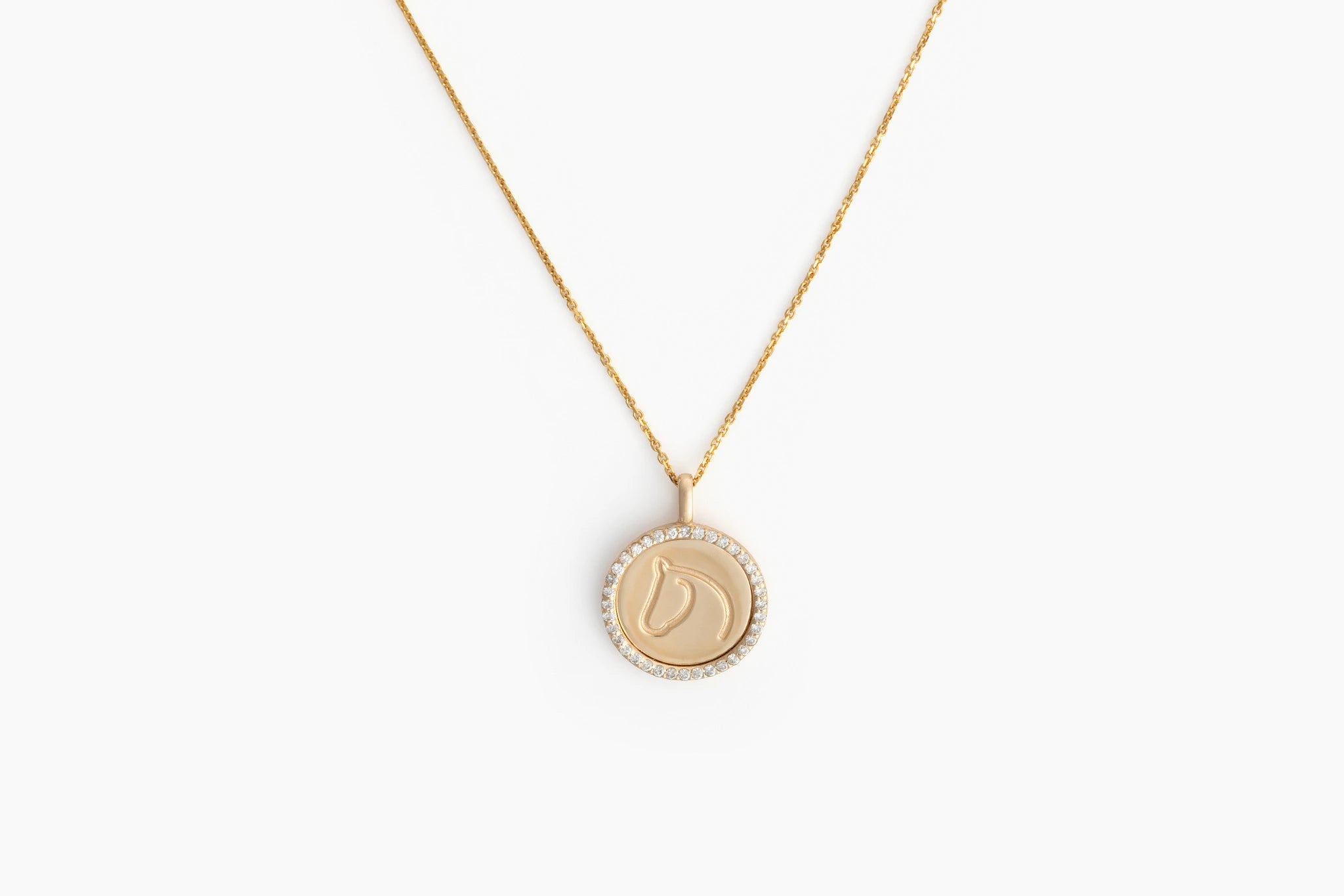 White Gold TGH necklace with diamonds on a beige mannequin.