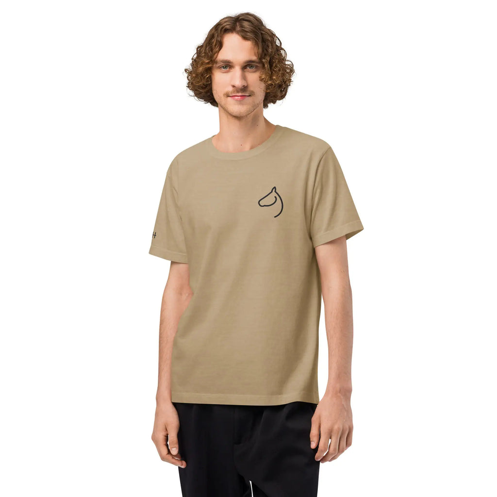Man wearing The Gilded Horse sand oversized tee with horse-head chest embroidery